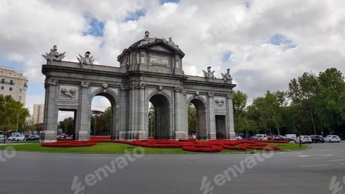 Preview: Puerta de Alcala Neo-classical gate in Madrid during day with traffic