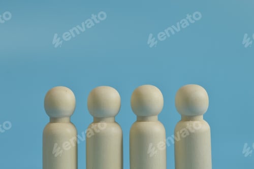 Preview: Wooden figures of people in a row. Teamwork concept.