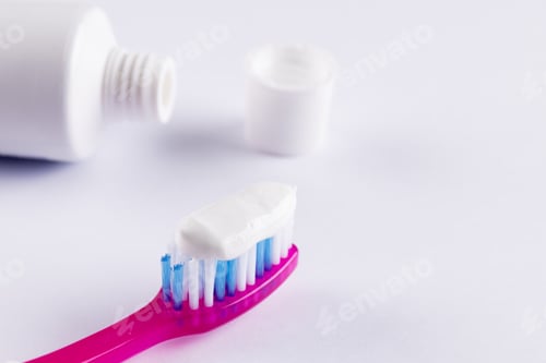 Preview: Image of toothbrush and toothpaste on white surface