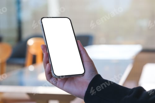 Preview: Mockup image of a woman holding mobile phone with blank desktop screen in cafe
