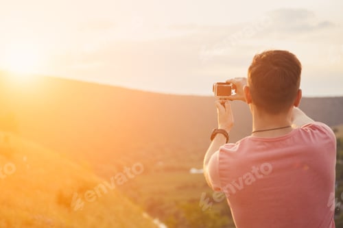 Preview: Young man smiling and enjoying sunny summer day