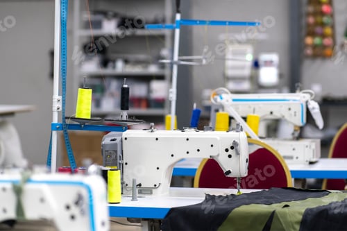 Preview: inside of textile manufatory, modern industrial sewing equipment
