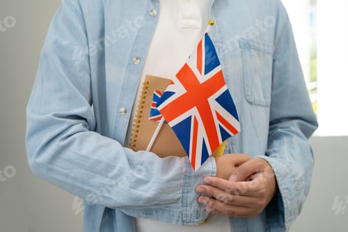 Preview: Learn English language, Asian teenage student hold book with flag in course at school.