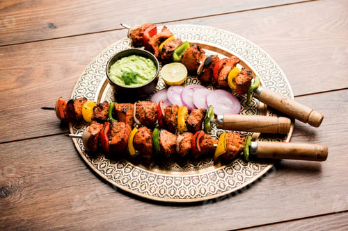 Chicken Kabobs on an Ornate Gold Plate