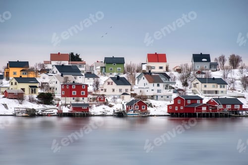Preview: Colorful scandinavian wooden house on snowy at coastline