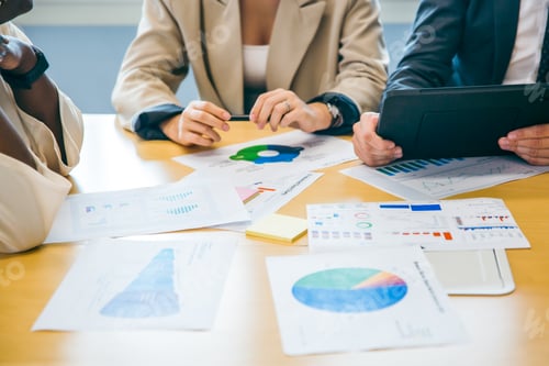 Preview: Business Meeting with Charts and Digital Technology