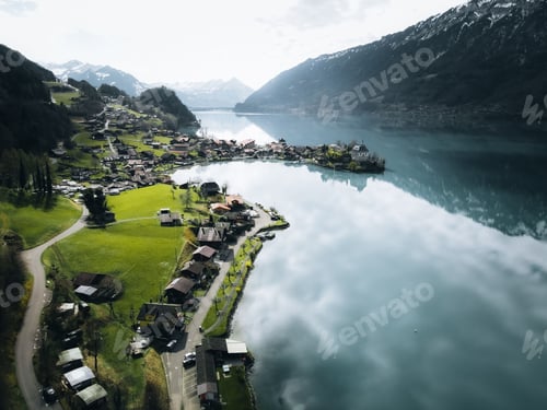 Preview: Aerial view of the Seeburg Castle surrounded by lake in Iseltwald village, Switzerland