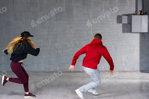 Preview: Young man and woman dancing modern dance.
