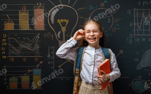 Preview: Enthusiastic Girl Student with Book in Classroom