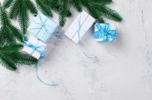 Preview: Gift Boxes with Blue Ribbons and Pine Branches