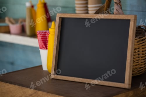 Preview: Writing slate on wooden table in food truck