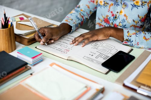 Preview: Hands Working on Office Desk with Notebooks and Stationery on Wh