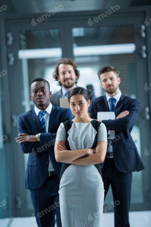 Preview: Confident businesspeople standing in office