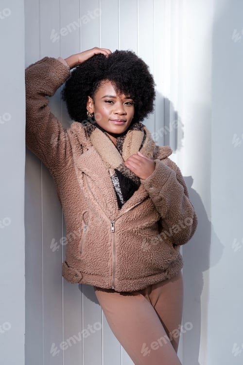 Preview: Young female model posing outdoors with attitude.