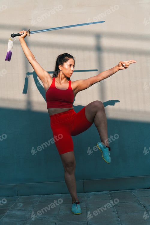 Preview: Chinese young woman practicing wushu kung fu.