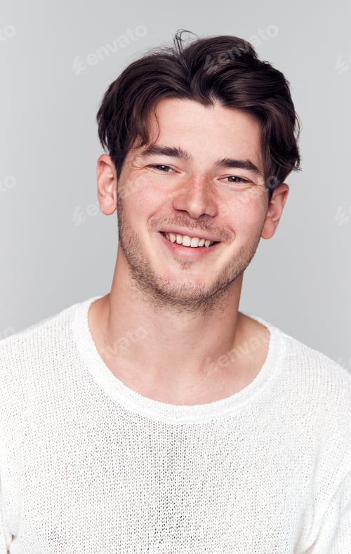 Preview: Studio Portrait Of Young Man Wearing White T Shirt Smiling At Camera