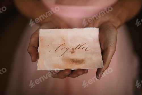 Preview: woman hands holding a message on paper
