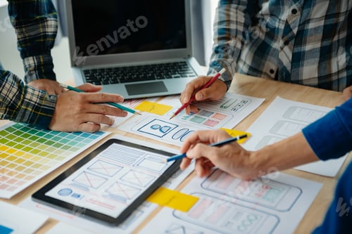 Preview: UX developer and ui designer brainstorming about mobile app interface wireframe design with