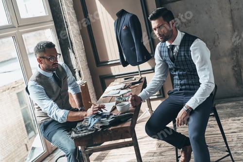 Preview: Tailors Designing Bespoke Suit in Fashionable Studio
