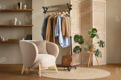 Preview: Trendy capsule wardrobe in beige and light blue on a rail rack