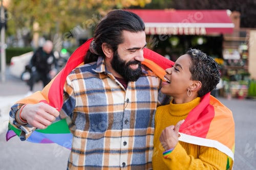 Preview: Two friends celebrating lgtbi pride day with the rainbow flag. Concept: pride, symbols, civil rights