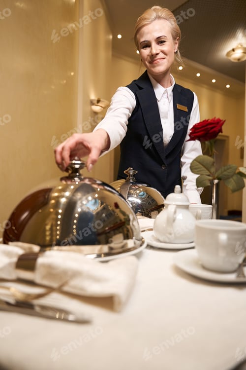 Preview: Hotel waitress on trolley delivered hot food to hotel room