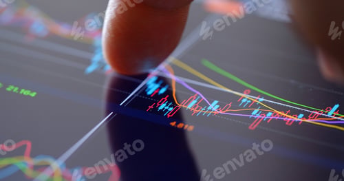 Preview: Finger touch on screen with stock market data