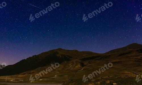 Preview: Panoramic shot of a mountain landscape on a stary night background