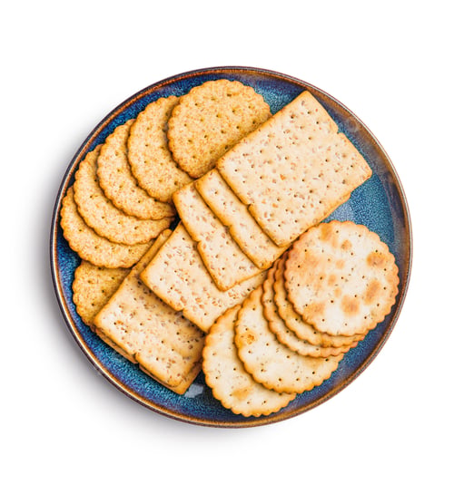 Preview: Salted crackers isolated on plate on white background.