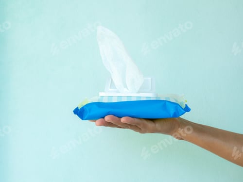 Preview: Hand woman holding wet wipe