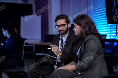 Preview: software developers smile with satisfaction during a pair programming session