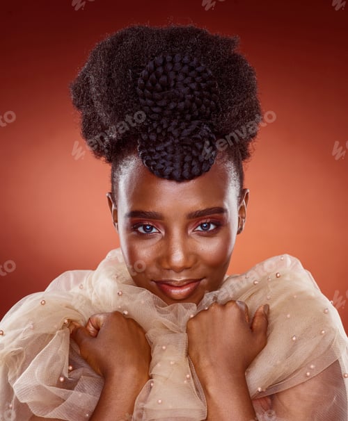 Preview: Cropped portrait of an attractive young woman posing in studio against a red background