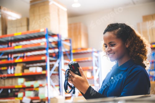 Preview: warehouse worker using bar code scanner to scanning box and analyze newly arrived