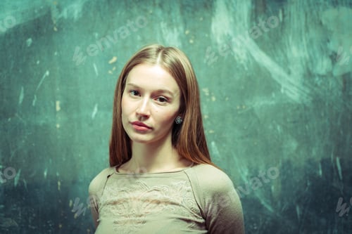 Preview: Portrait. Girl On A Gray Wall Background