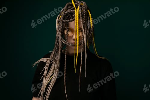 Preview: Woman With Dreadlocks in Front of Green Background