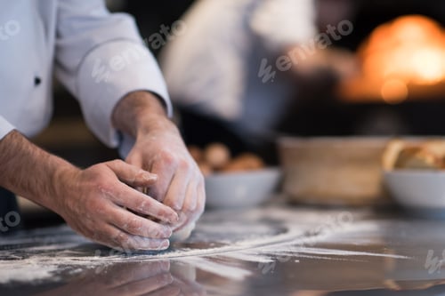 Preview: chef hands preparing dough for pizza