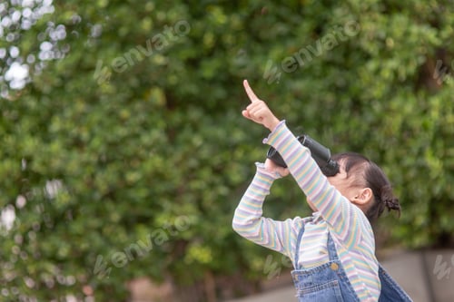 Preview: Happy kid looking ahead. Smiling child with the spyglass. Travel and adventure concept.