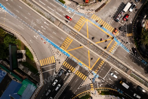 Preview: traffic moving through a busy intersection surrounded by buildings . Kuala Lumpur. Malaysia