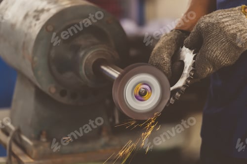 Preview: Closeup angle Grinder hand holding and Grinding the spare parts of metal gear