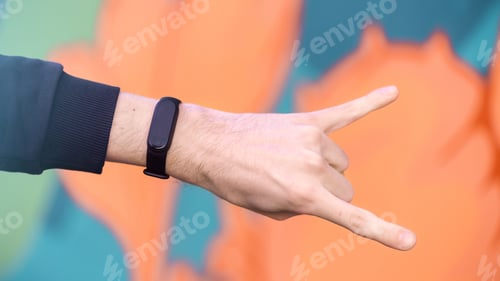 Preview: A male hand with fitness bracelet