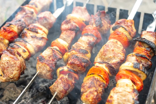 Preview: Grilled fried pork meat, pieces of meat on skewers.