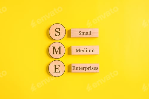 Preview: SME, Small Medium Enterprises word on wooden cubes with copy space, Start up small business