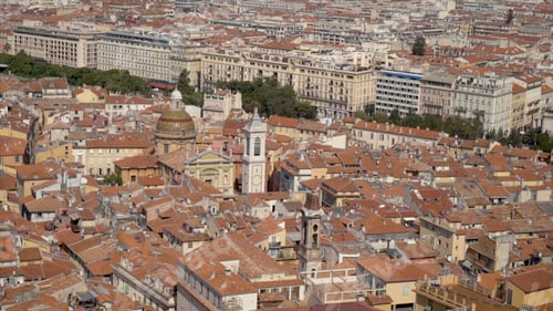 Preview: Top view of old european city with orange roofs. Action. Close and compact location of residential