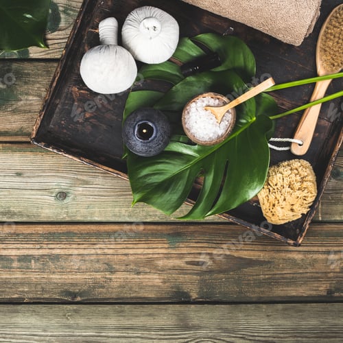 Preview: flat lay layout with monstera leaves and cosmetic care products