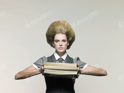 Preview: Businesswoman holding files