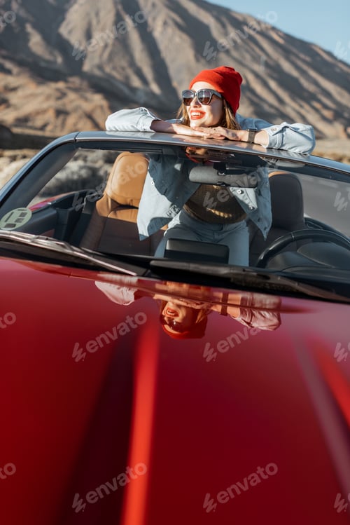 Preview: Carefree woman traveling by car