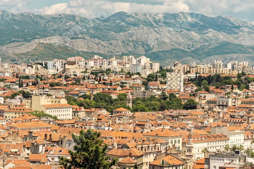 Preview: Panoramic view of a cityscape with residential and commercial buildings against