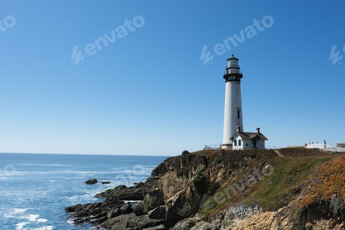 Preview: Beautiful shot of a lighthouse on a rocky cliff by a beach