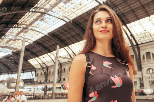 Preview: Woman standing at train station