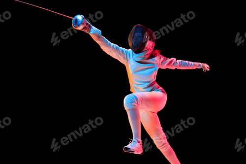 Preview: Teen girl in fencing costume with sword in hand isolated on black background